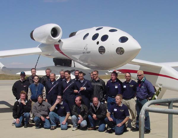 Scaled Composites employees pose in front of White Knight